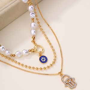 Collar de cadena de eslabones de <span class=keywords><strong>perlas</strong></span> doradas con colgante de aleación de imitación de <span class=keywords><strong>ojos</strong></span>, elegante y de nicho, para mujer, estilo vintage, para la clavícula. - Product Image 3