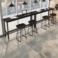 Table de bar industrielle longue en bois massif carbonisé noir avec structure métallique pour café, restaurant, maison, côté fenêtre