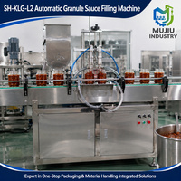 Machine de remplissage électrique automatique à deux têtes SH-KLG-L2 de haute précision pour granulés plastiques et sauces, avec trémie agitée pour bouteilles/bocaux en verre
