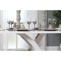 Table à manger moderne de luxe en marbre avec base en acier inoxydable pour villas