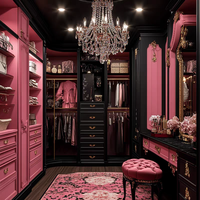 Armoire de chambre à coucher noire, blanche et rose, avec placage bois sculpté, poignée métallique de style mid-century, porte battante, meuble de rangement.