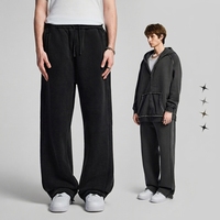 Pantalon de survêtement en molleton de coton 430 g/m² de haute qualité, avec patch asymétrique et bords bruts, coupe droite, vierge, pour homme