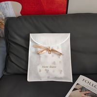 Sacs de vêtement non tissés personnalisables | Emballage anti-poussière à pression plate | Sacs de rangement Innerwearr en gros
