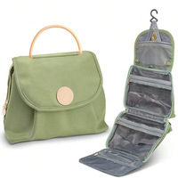 Nouveau sac de rangement en cuir imperméable pour cosmétiques et articles de toilette avec crochet pour les voyages
