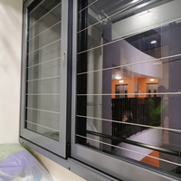 Système de fenêtre coulissante en aluminium à rupture de pont thermique personnalisé avec barres de sécurité, verre isolant et glissière horizontale pour maison moderne