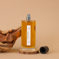 Design de luxe 150ml bouteille de parfum ronde bouteille de parfum en verre à base lourde avec pompe à brouillard couvercle en argent noir