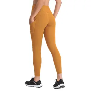 Nylon spandex mujeres entrenamiento compresión leggings amarillo buttery suave entrenamiento legging, alta cintura bolsillo pantalón