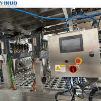 Machine de remplissage et de scellage automatique multi-têtes pour coupelles de sauce, biscuits et pâtes, avec balance intégrée