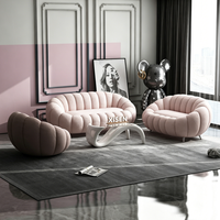Ensemble de canapés Boucle crème incurvés avec table basse en verre pour salon, salon de beauté, centre commercial, mobilier de salon de loisirs