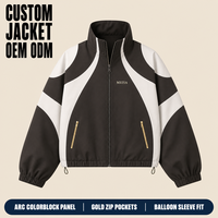 Veste coupe-vent marron personnalisée pour homme, avec empiècements colorblock, poche zippée dorée, manches ballon, ourlet à cordon de serrage, coupe oversize pour le streetwear