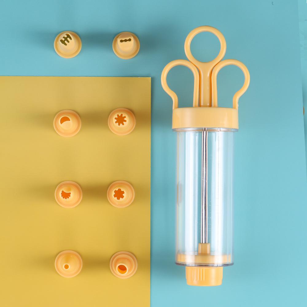 Pistola laminadora manual con jeringa amarilla