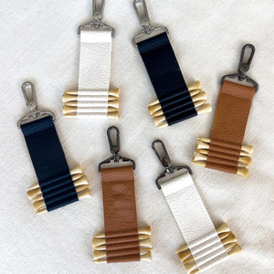 Multi-pack <b>golf</b> club pegs in stock, leather belt loop keychain TEE storage bag, PU leather, simple <b>golf</b> club peg cover. - Product Image 1