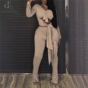 女性用パッチワーク長袖ホロートップ+フレアパンツセクシーイレギュラーノット2ピースセット - Product Image 1