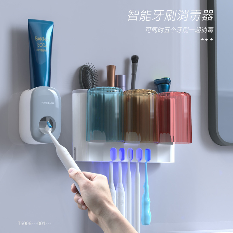 A gray toothpaste squeezer for a family of three