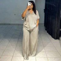 Ensemble pantalon long et haut rayé à col en V ample et décontracté pour femme, collection été 2025, style européen