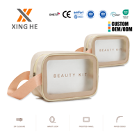 Sac cosmétique en PVC givré personnalisé avec logo, durable et respectueux de l'environnement, de la marque XingHe, avec boucle de poignet, pour les voyages et le maquillage