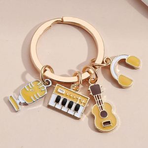 Nuevo y Popular Llavero Colgante para Bolso con Diseño de Notas Musicales, Fonógrafo, Teclado, Auriculares, Micrófono, Piano, Violín y Banda - Product Image 1