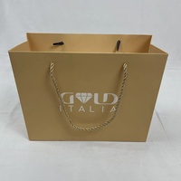 Emballage cadeau personnalisable en or mat avec poignée torsadée en corde, respectueux de l'environnement, pour les boutiques de marque et les magasins de détail