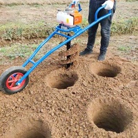 Tarière thermique manuelle à roues pour la plantation d'arbres et le forage du sol