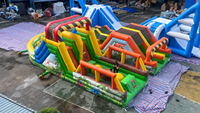 Parcours d'obstacles gonflable dinosaure Lilytoys avec deux toboggans, sauteur en PVC certifié CE pour enfants