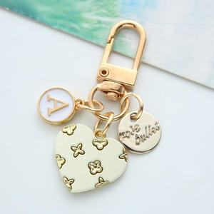 Nouveau amour alliage porte-clés mignon fleur coeur lettre cercle marque métal pendentif écouteur couverture sac suspendus ornements - Product Image 5