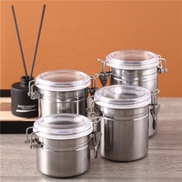 Vente en gros de quatre pièces en acier inoxydable S.S410 Ensemble de bidons Réservoir de stockage de grains de café avec couvercle scellé Récipient de stockage des aliments de cuisine