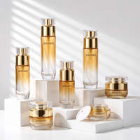 Flacon pompe et pot à crème en verre ambré dégradé de luxe OEM ODM avec logo personnalisé pour emballage de coffret cosmétique et soins de la peau