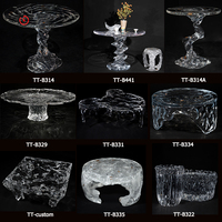 Mesa auxiliar esquinera de acrílico cristalino platino transparente para sala de estar moderna de alta gama TT, ideal para espacios pequeños.