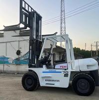 Chariot élévateur diesel TCM FD70 d'occasion robuste et fiable, 7 tonnes, à moteur Isuzu, pneus pleins 4x4, levage hydraulique