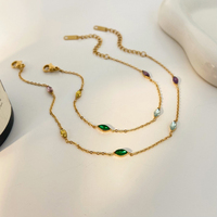 Parure de bijoux fantaisie en acier inoxydable plaqué or avec zircon œil de cheval coloré en acier titane, comprenant collier, bracelet et chaîne de cheville