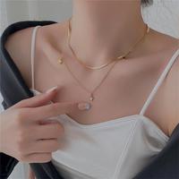 Ensemble collier et bracelet tendance en acier inoxydable plaqué or 18 carats avec pendentif coquillage pour femmes