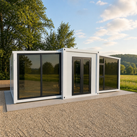 Maison conteneur pliable panoramique en verre blanc pour le glamping et l'hébergement temporaire