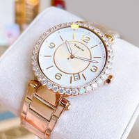 Montre élégante pour femmes, boîtier rond en cristal, cadran en nacre, date, bracelet en acier inoxydable, lunette en strass, montre-bracelet pour dames
