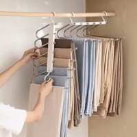 Porte-pantalon multifonctionnel en acier inoxydable au design moderne, pliable et rétractable, gain de place pour rangement de garde-robe