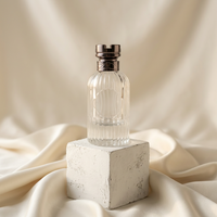 Flacon de parfum en verre transparent de luxe, nouveau design, 100 ml, avec vaporisateur anti-fuite et boîte d'emballage personnalisée