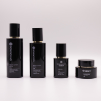 Botol Kemasan Kosmetik Serum Lotion Krim Mewah Silinder Kaca Hitam Modern Sederhana Set Tutup Sekrup Pompa Ramah Lingkungan