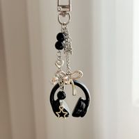 Étui pour écouteurs perlé fait main, design original style pointillisme personnalisé, porte-clés, breloque de téléphone personnalisée, pendentif de sac à dos