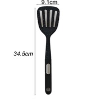 Ustensile de cuisine en gros : Spatule ajourée antiadhésive en acier inoxydable avec manche en nylon et TPR, légère, écologique, antidérapante, noire