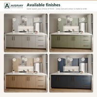 Meuble de cuisine de luxe en PVC avec îlot central, portes en dalles grises, rangement par tiroirs, livraison en kit et boîtes de rangement en panneaux de particules