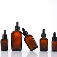 Vente en gros de flacons compte-gouttes carrés en verre ambré de 30ml Récipient d'huile essentielle de luxe avec une commande minimum de 100 pièces emballé dans des cartons