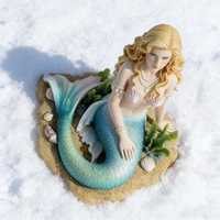 Sculpture de sirène en résine artistique, figurine de sirène assise sereine avec détails de coquillages et d'algues