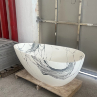 Baignoire autoportante en forme d'oeuf en marbre blanc de luxe Baignoire de trempage en pierre artificielle solide au design moderne pour hôtels