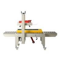 Machine à sceller les cartons FXC-5050 120W à entraînement latéral, scelleuse de boîtes à ruban adhésif W150-500mm pour cartons ondulés