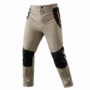 กางเกงเดินป่า SFB123 น้ำหนักเบา ยืดหยุ่นได้ สำหรับผู้ชาย สีกากี ผ้า softshell ป้องกันหัวเข่า พร้อมซิปกระเป๋าข้าง สำหรับตั้งแคมป์และปีนเขา - Product Image 1