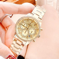 Montre chronographe de luxe pour femmes MKOriginals en acier inoxydable doré, avec lunette pavée de cristaux, aiguilles, étanche, fermoir pliant