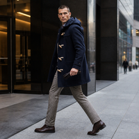 Manteau long élégant pour homme, coupe ajustée, aspect laine, col à revers cranté, boutons en corne, respirant, service OEM/ODM de qualité supérieure