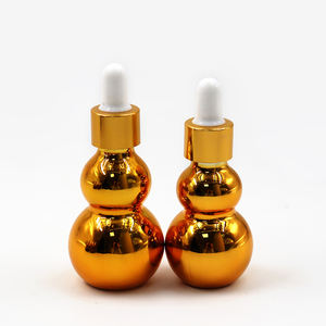 Bouteilles en verre compte-gouttes transparentes ambrées brillantes en forme de cantaloup de 15 ml, 20 ml, 30 ml, 50 ml pour huiles essentielles - Product Image 1