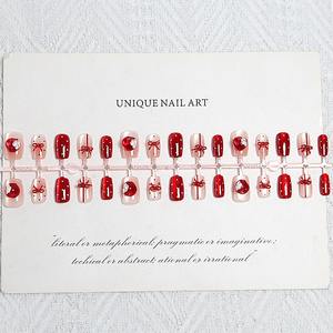 Uñas Postizas Z555 con Diseño de Lunares Rojos y Lazo Navideño, ABS Premium, Aspecto Brillante, Estilo Viral, Disponibles al por Mayor, Fáciles de Aplicar - Product Image 4