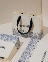 Sacs en papier personnalisés avec logo imprimé à prix réduit emballage de vêtements de luxe pour boutique sacs à cadeaux pour petites entreprises vente en gros