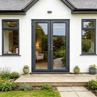 Porte intérieure en verre double vitrage transparent avec cadre en aluminium, fournie par l'usine HUACAI, pour entrée de maison ou hall.
